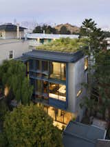 The two monolithic walls on the north and south sides are integrally colored, steel-troweled plaster. They anchor the home in its site as well as provide privacy from neighboring homes. 
