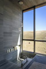 “The owner wanted the master bathroom to be spartan but elegant,” says architect Hunter Gundersen. “He came across a recessed tub and loved the idea. There’s something special about descending down into the architecture rather than sitting in an additive object on the architecture.”