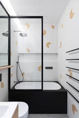 The kids' bath is playful while adhering to the home's overall color and material palettes.